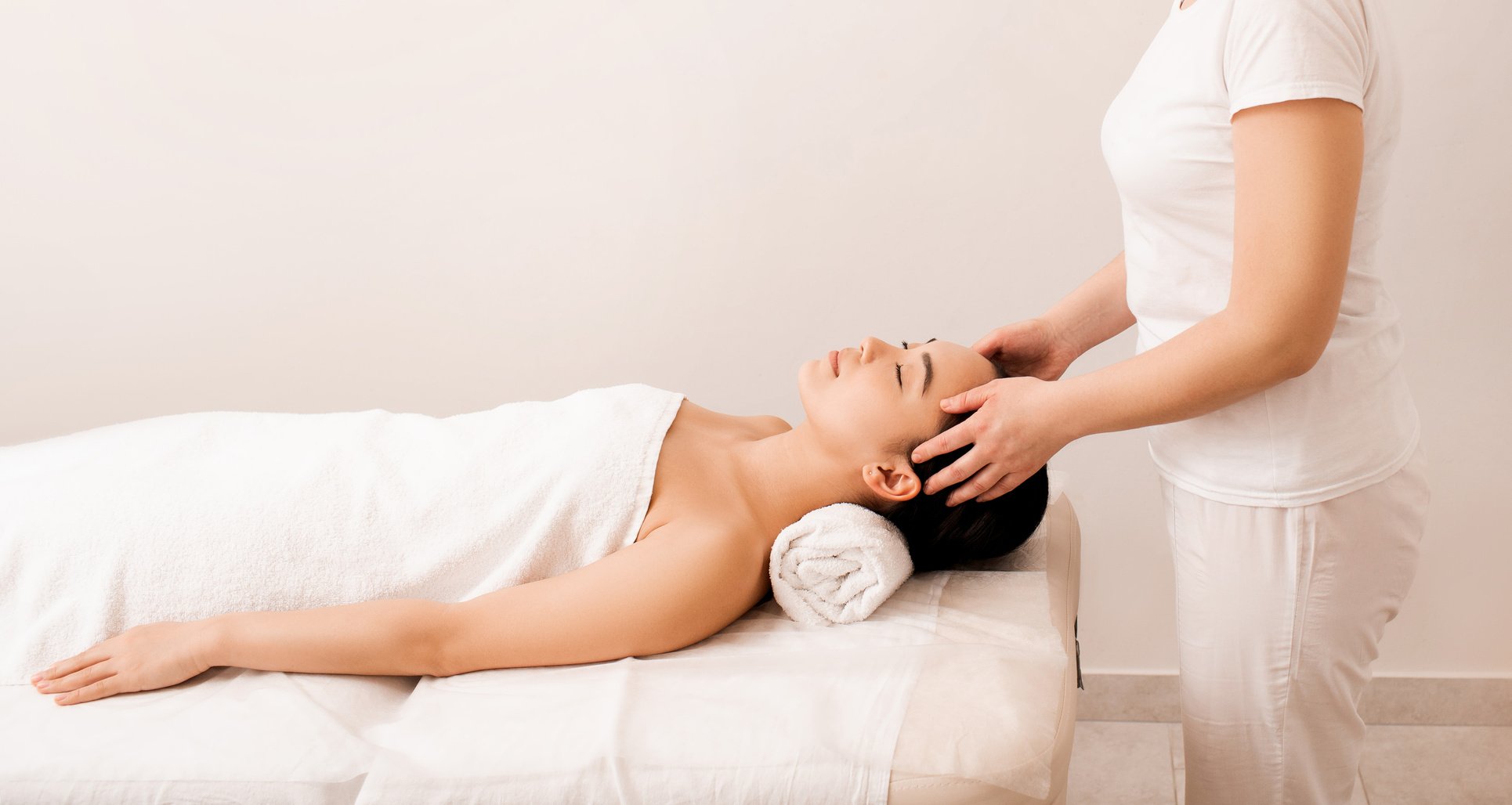 Thai massage. Asian woman during anti-stress head massage in spa salon