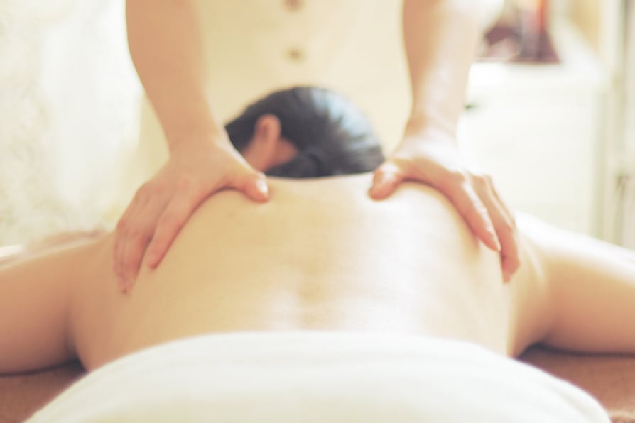 Woman receiving an aroma oil massage